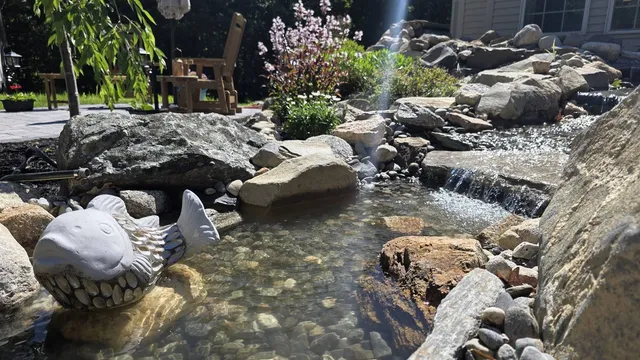 Pondless waterfall and stream with natural boulders built by Globe Green near Concord, NH