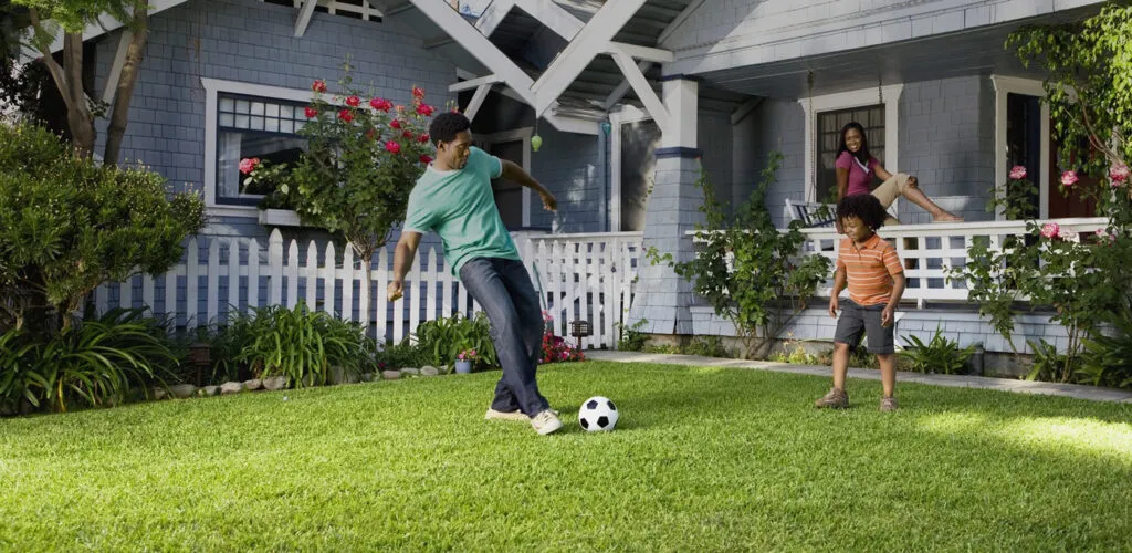 Family on a LawnSquad Lawn Treated Lush Green Lawn