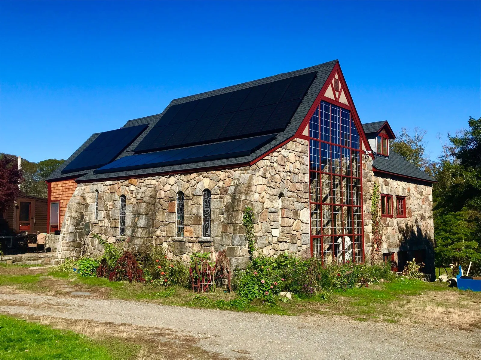 A older church in Massachusetts with solar electric (PV) panels on the roof