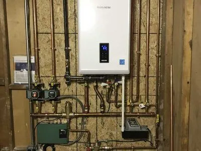 Tankless water heater and near-boiler piping