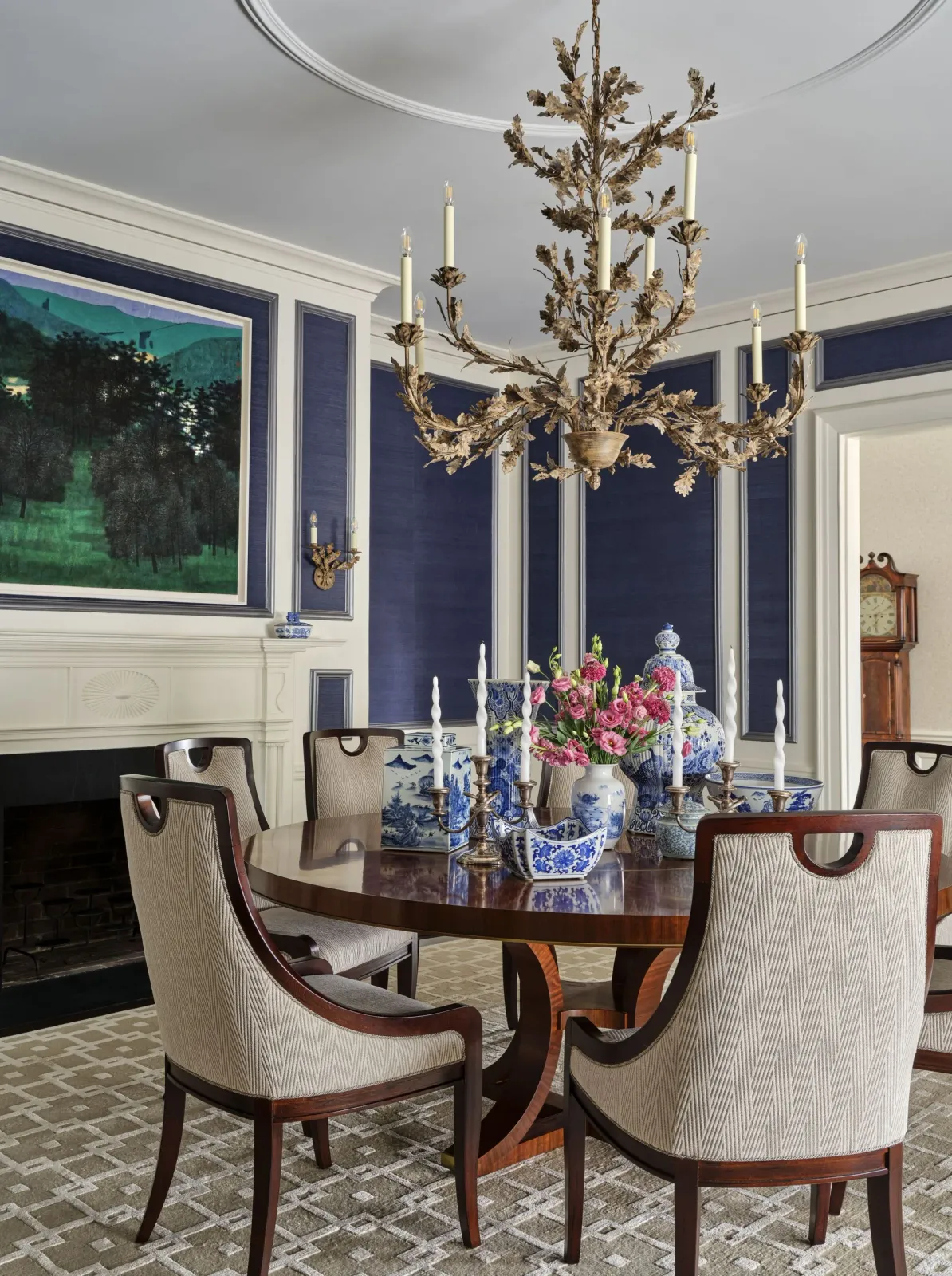 An elegant dining room with a table and chairs and a chandelier