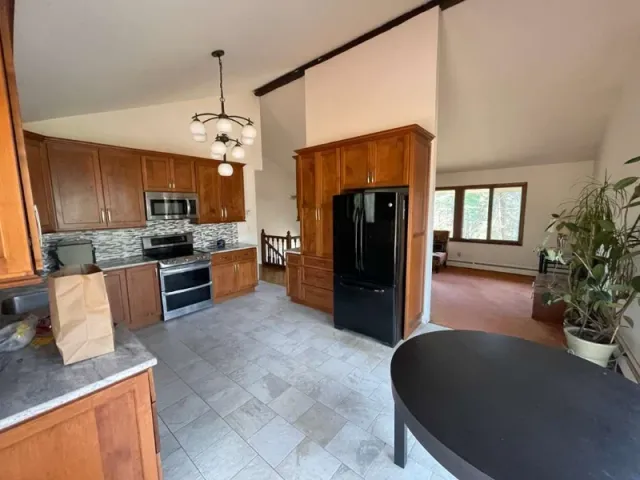 Dated Fairfield County, CT kitchen with brown cabinets before a Cross Tiles remodel