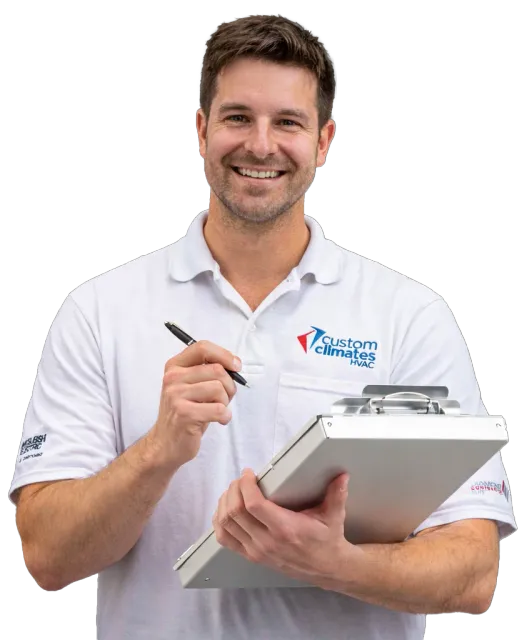 Custom Climates HVAC technician with clipboard ready to write your estimate