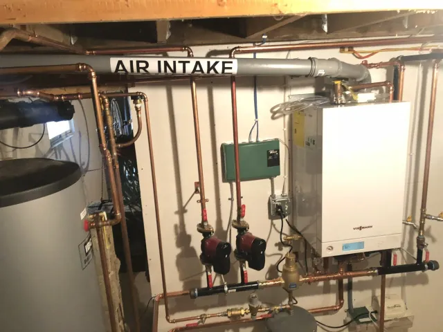 Heating Services — Man Holding A Heater Meter in Lee, MA