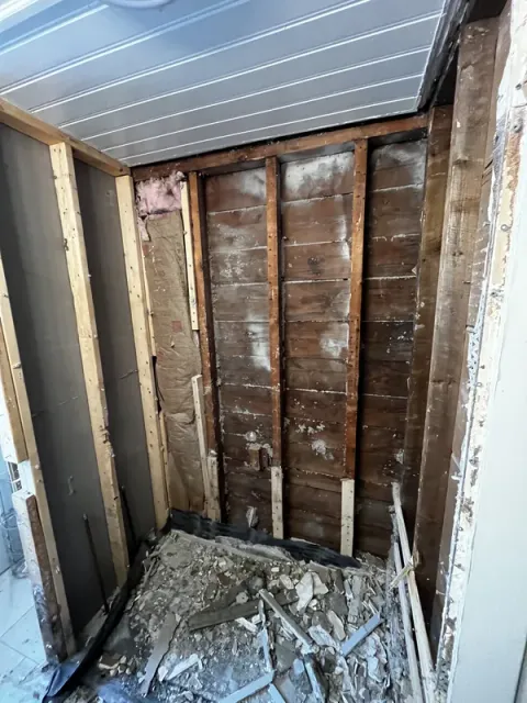 Bathroom before demolition — old tub and dated tile