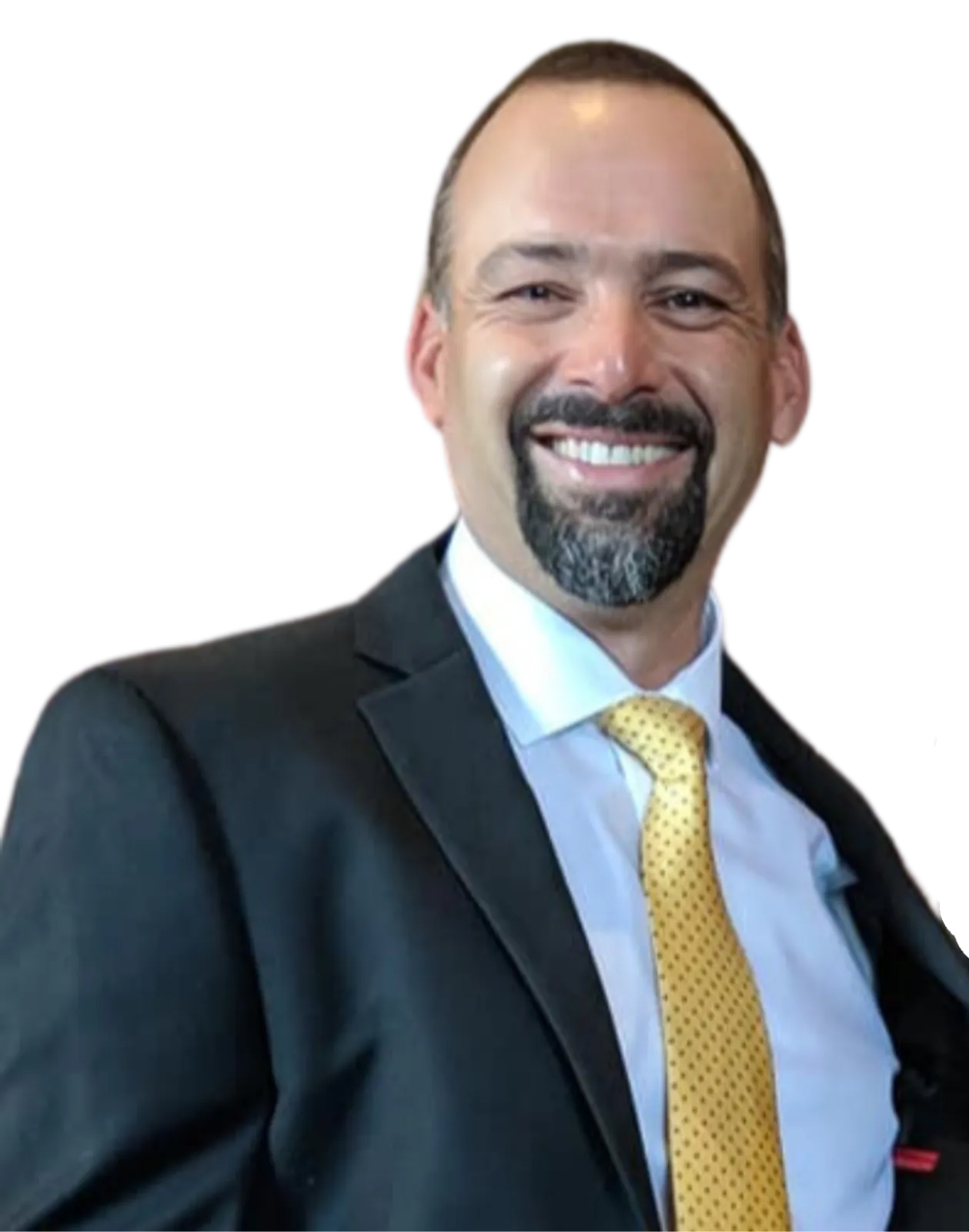 A smiling man in a suit with a yellow tie, white shirt, and a dark blazer.