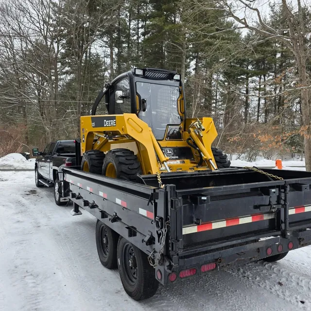 Truck with a skid steer loaded on the trailer