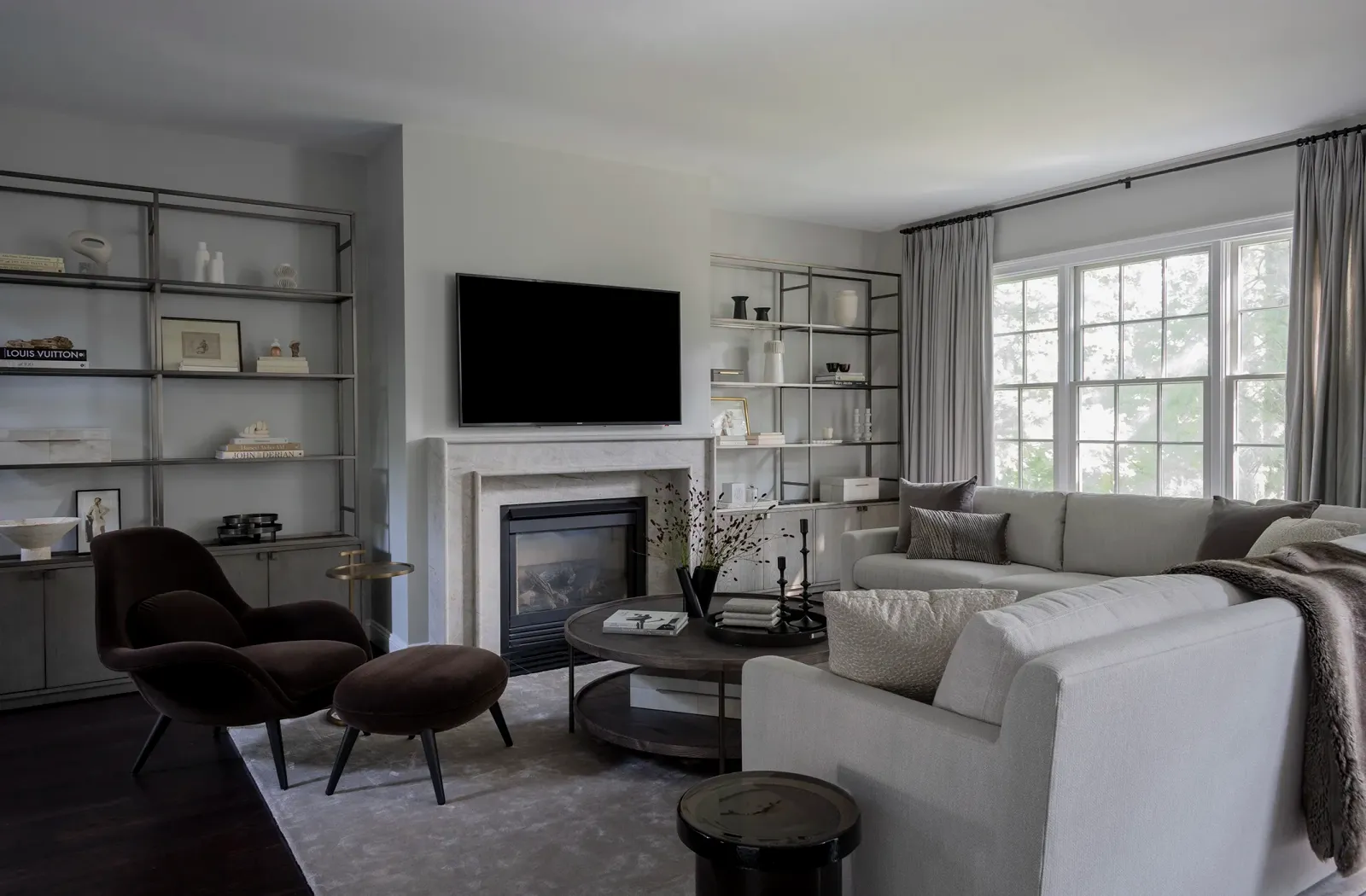 Living room with built-in shelving flanking the fireplace