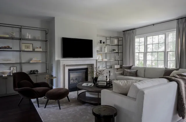 Living room with built-in shelving flanking the fireplace