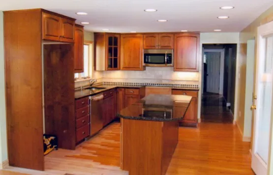Kitchen remodel with island and hardwood flooring
