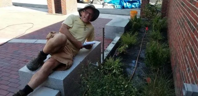 Josh Harnik posing in front of drip system.
