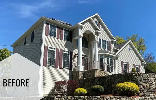 The exterior of a large house. The image highlights the quality of the materials and the attention to detail, showing a well-kept and luxurious-looking home.