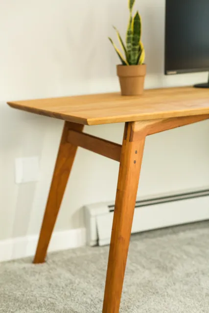 A solid hardwood midcentury modern desk featuring white oak and sapele.