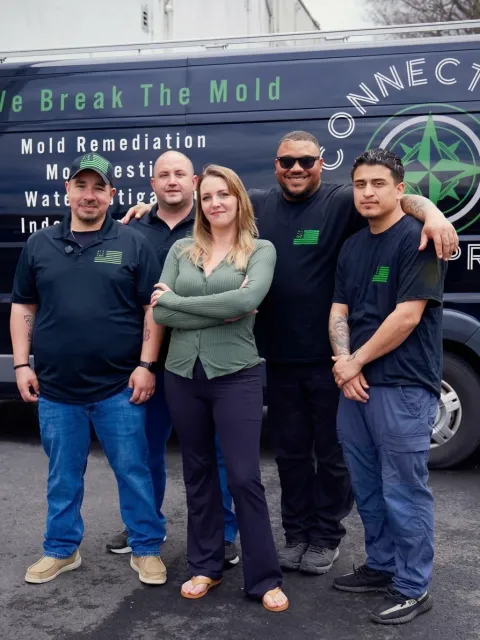 The CT Mold Pros team in front of their mold remediation van in Connecticut