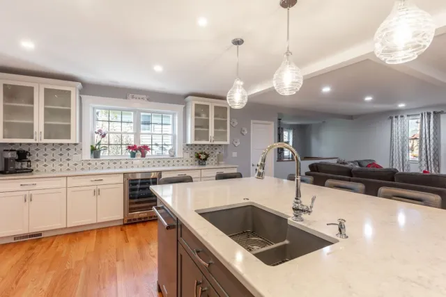 open kitchen flowing into living space in Melrose MA whole house renovation by PEGASUS Design-to-Build-optimized