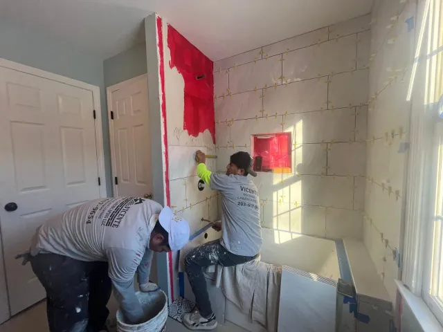 Vicente Pintado founder of Vicente Masonry working on stone project in Connecticut