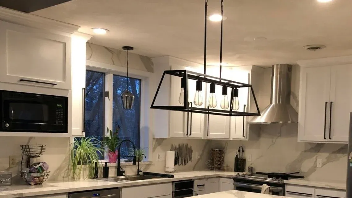 After image of a white shaker cabinet kitchen remodel with island — Essex County, MA