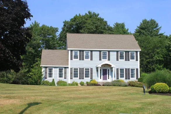 Grey-sided colonial with farmer's porch entry