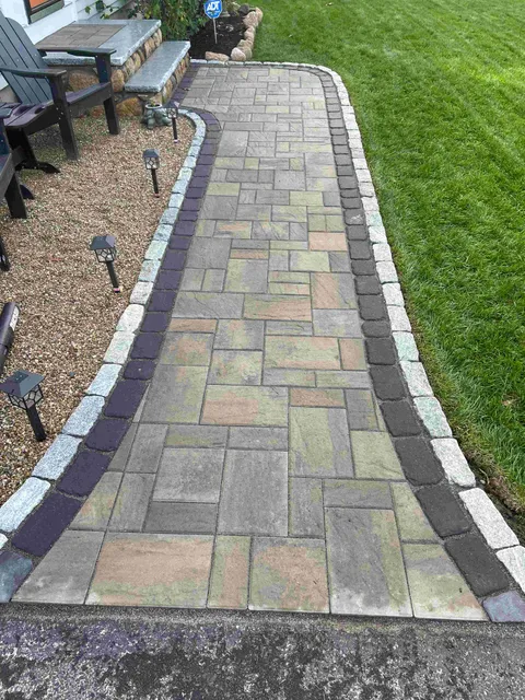 Stone patio with fire pit built by Motto Brothers Landscaping in Wareham MA