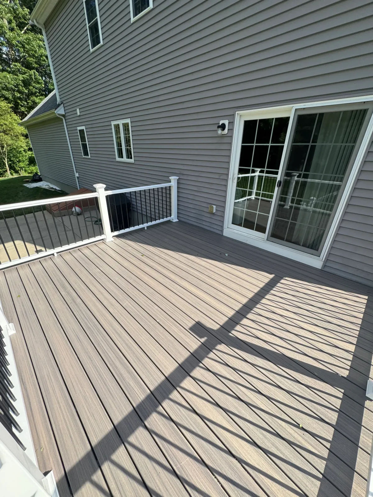 Composite deck outside sliding glass door