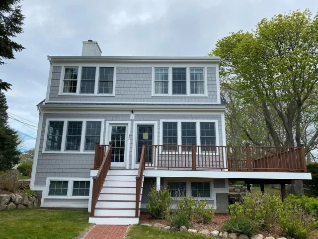Remodel with James Hardie siding, Azek trim, asphalt roof and portico construction.