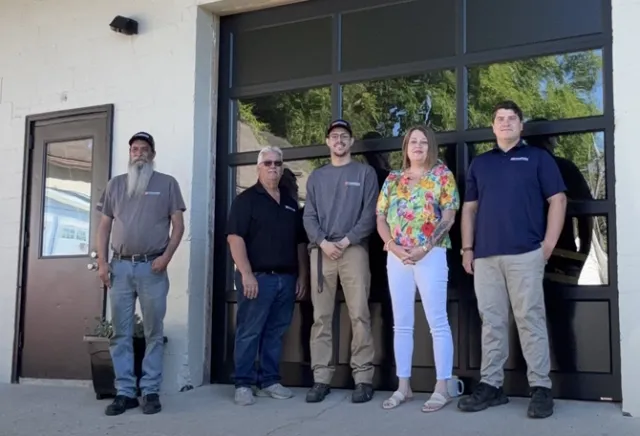 Door Systems Easthampton team in front of a garage door