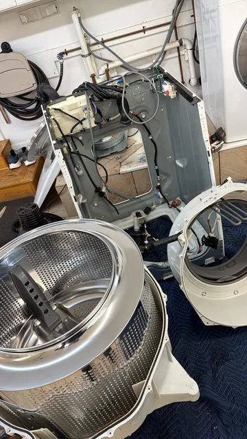 Interior of a front-loading washing machine during preventive maintenance service
