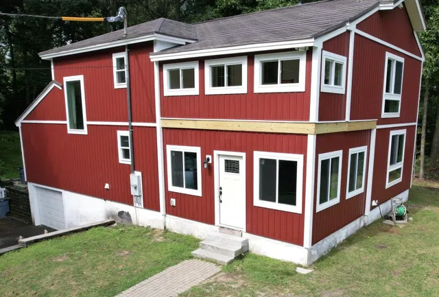 Red 7-inch board and batten siding installed by WG Construction in Salem, NH
