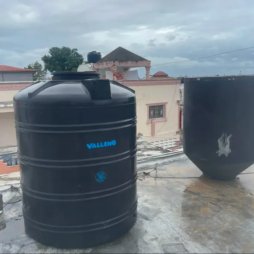 Rooftop water storage tanks connected to supply piping by Aroso Plumber Methuen