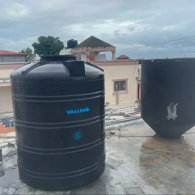 Rooftop water storage tanks connected to supply piping by Aroso Plumber Methuen