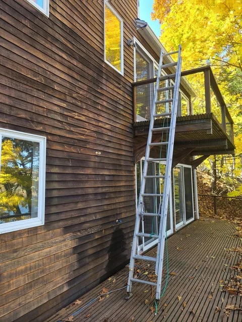 Staging set against a barn elevation for restoration work