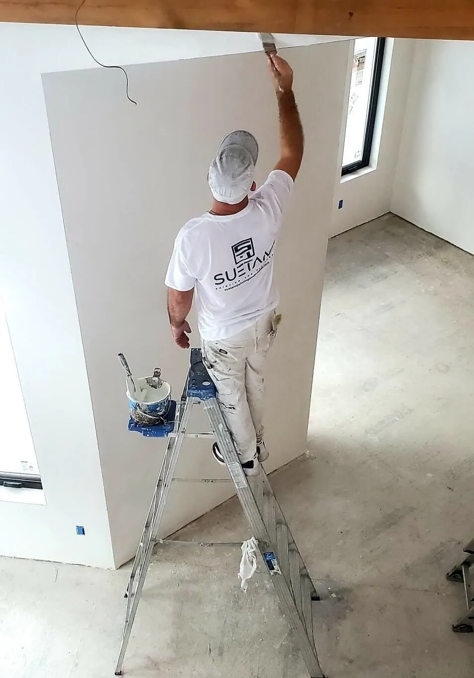 suetam painting painter working on home interior in andover