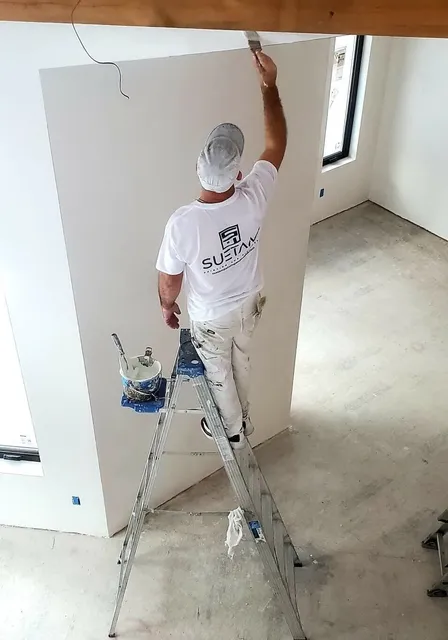suetam painting painter working on home interior in andover