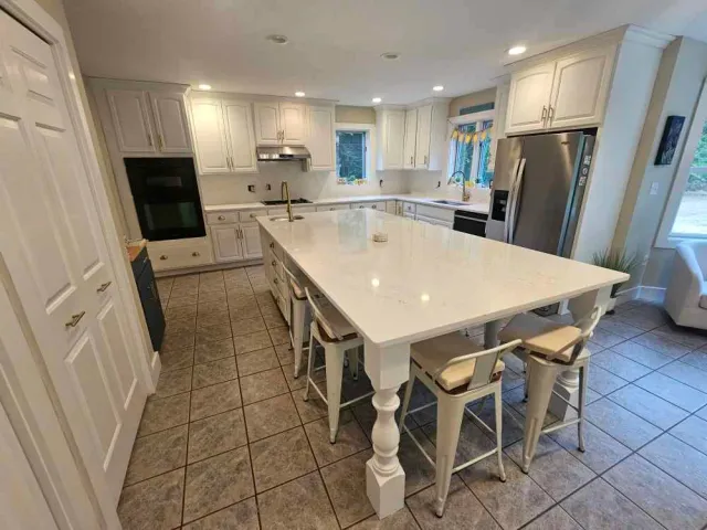 Quartz kitchen countertop with eased edge profile — custom countertop fabricated by Precision Granite Works in Wilmot, NH