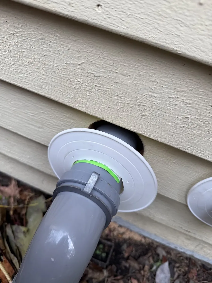 Ductless mini-split condenser and disconnect set under a deck