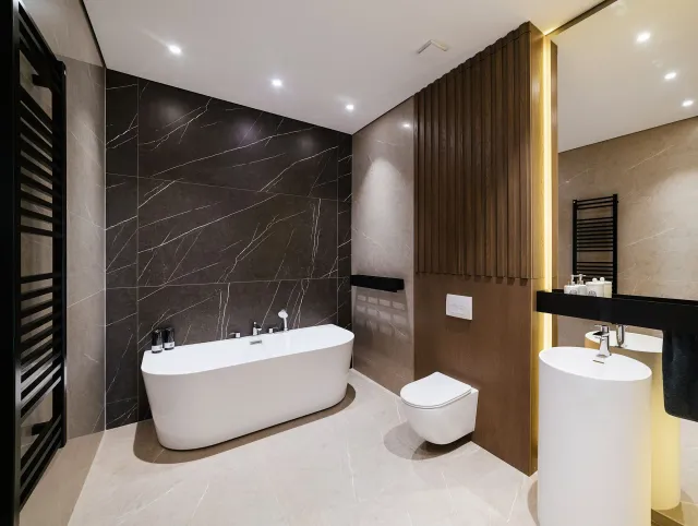 A bathroom with a bathtub toilet and sink