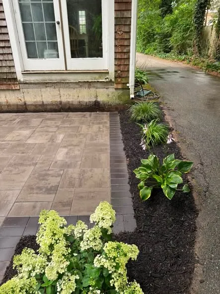Paver patio with new plantings and mulch bed