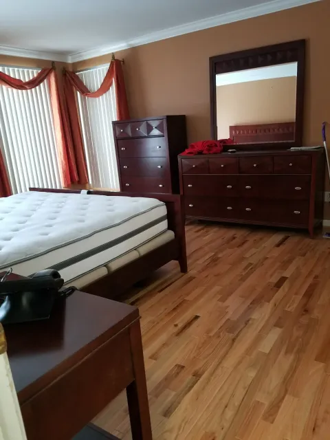 Bedroom With Wooden Floor