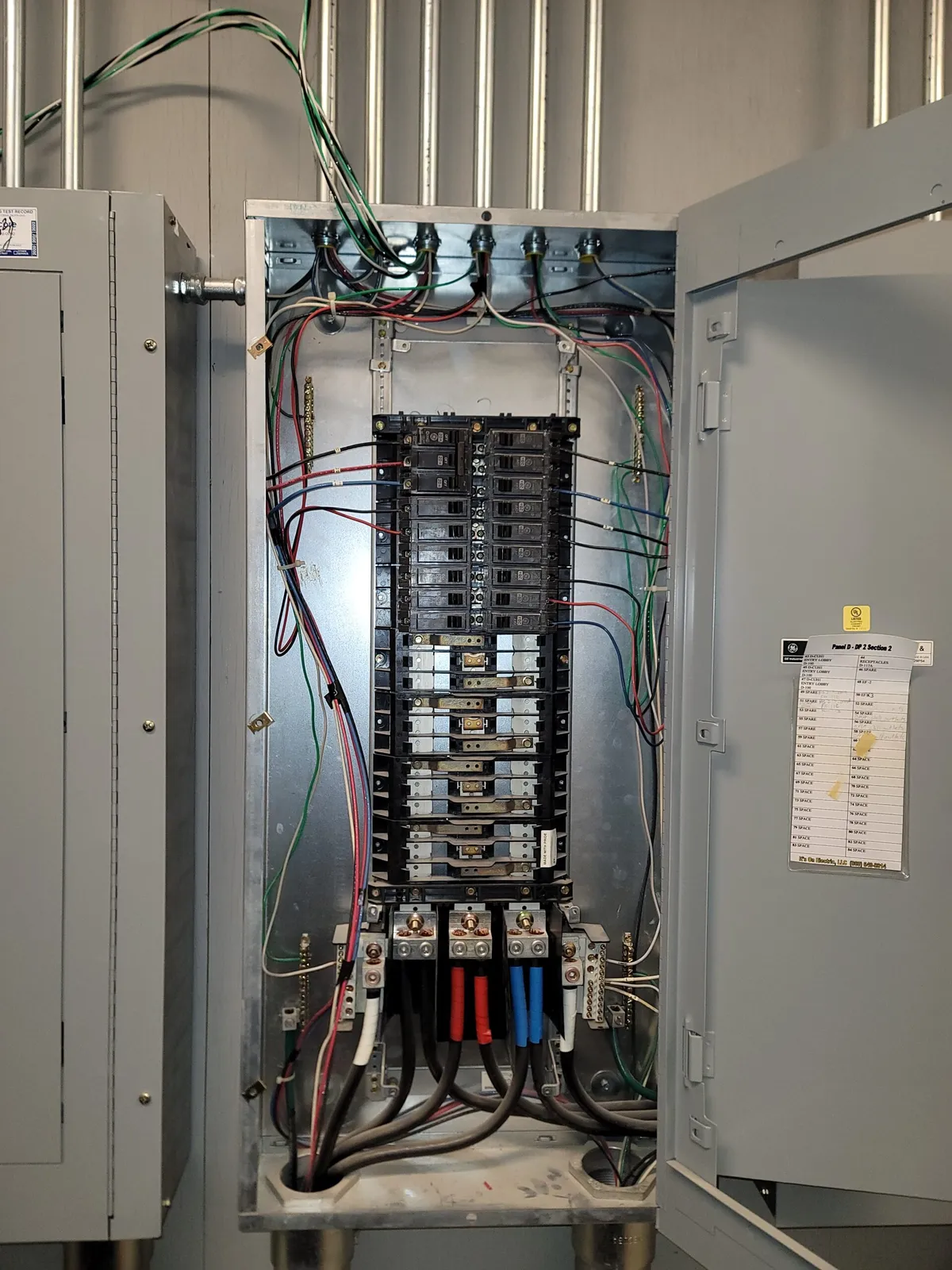 Commercial electrical panel installation with conduit and branch circuit wiring completed by Prevolt Electric.