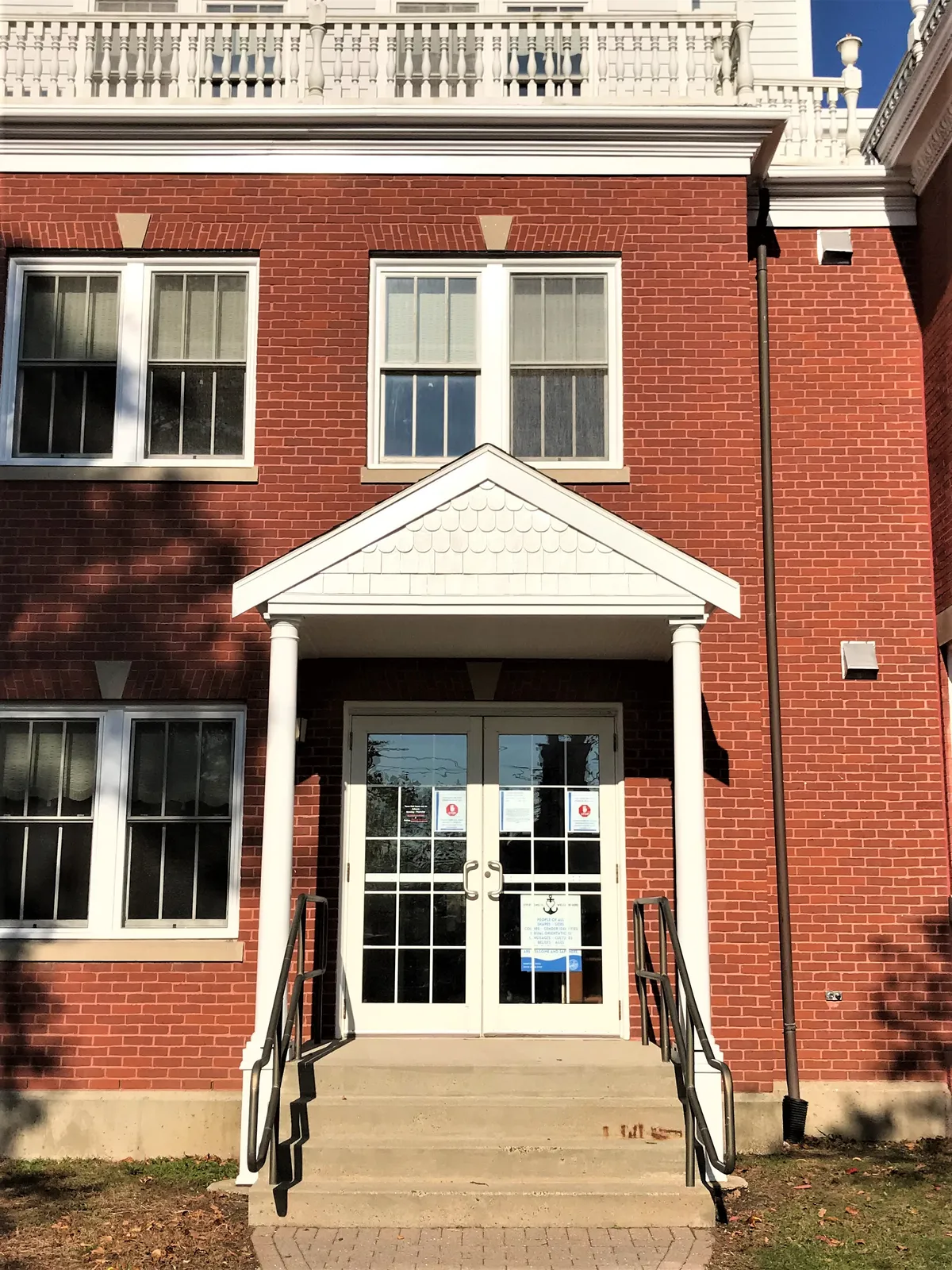 Restored brick building entry and portico