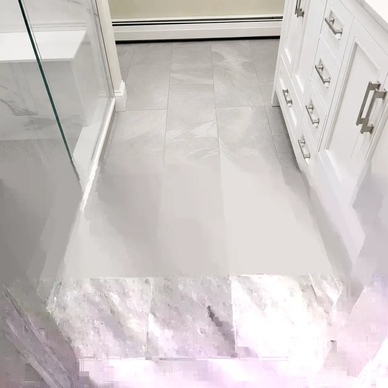 Restored shower tile and grout joints after repair work