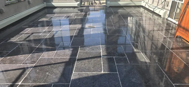 Dark stone tiles professionally polished