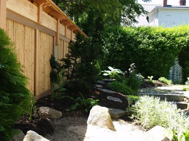Japanese inspired garden and fence. Fence bamboo base, cedar tops.
