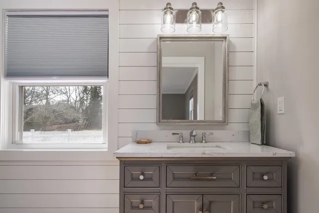 Bathroom vanity against a shiplap wall