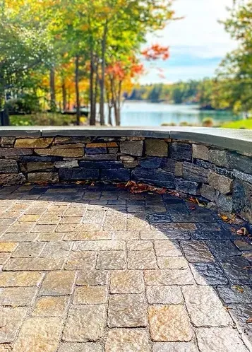 A stone patio and retaining wall