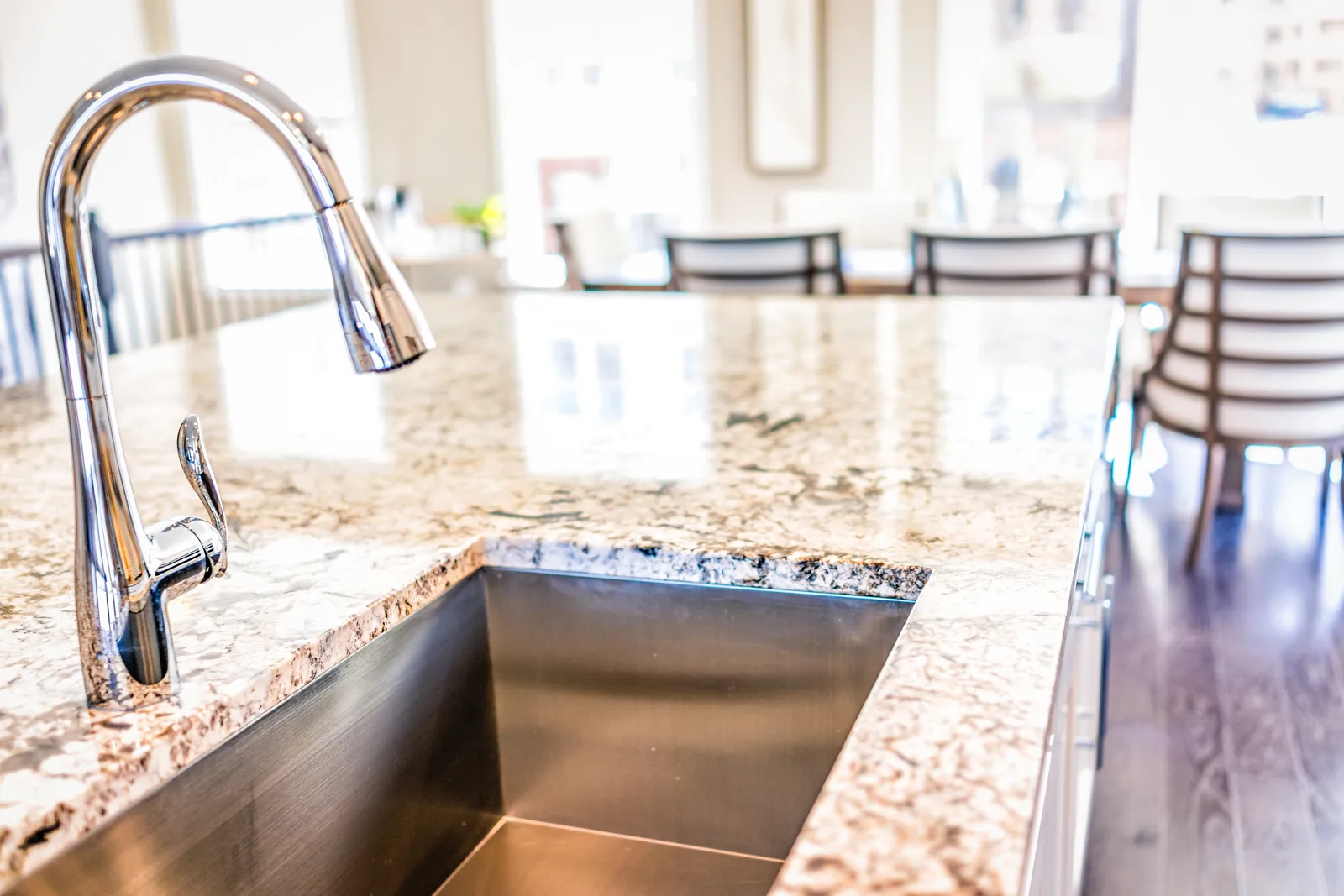 granite counter top with stainless steel sink and faucet