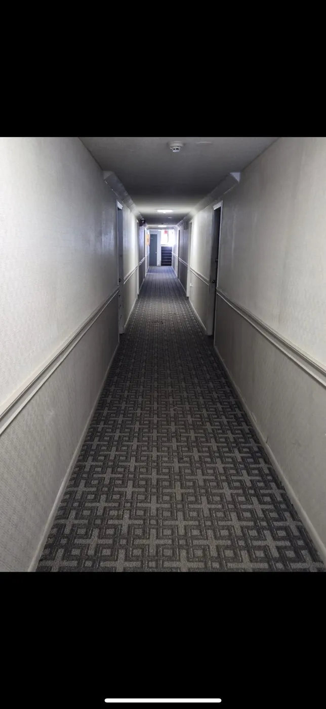 Apartment building corridor — before