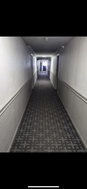 Apartment building corridor — before