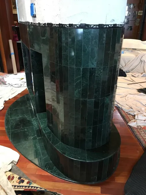 Green tiled column - custom tile work in progress
