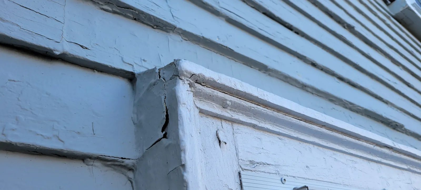 Damaged exterior trim before repair